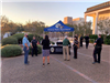 Police and residents mingle near a Victoria Police Department booth in the City Hall courtyard