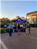 Police and residents mingle near a Victoria Police Department booth in the City Hall courtyard.
