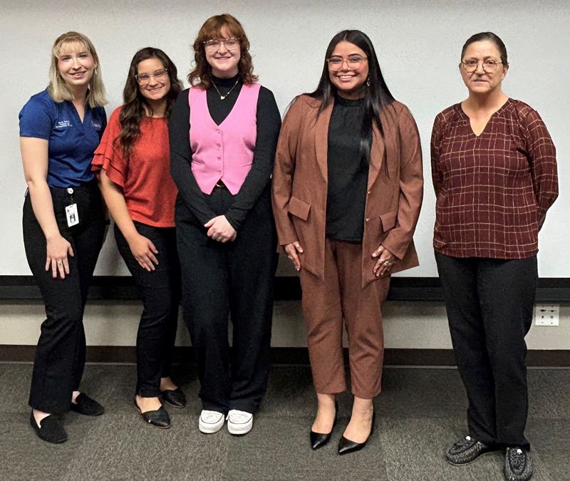 Group photo in City of Victoria conference room.