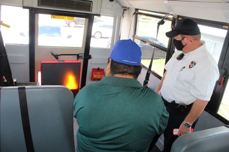 Fire extinguisher training on a VISD bus.
