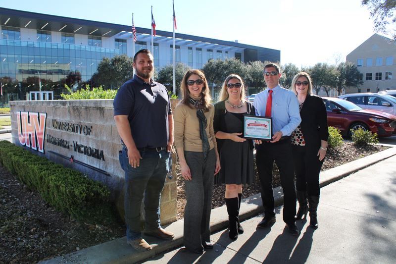 Group photo in front of UHV sign