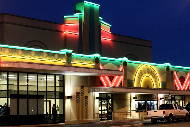 The Leo J. Welder Center for the Performing Arts is lit up at night.