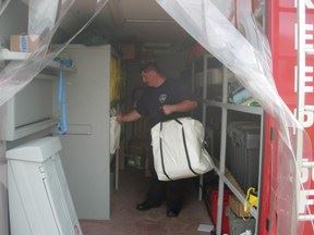 Person putting items on a shelf