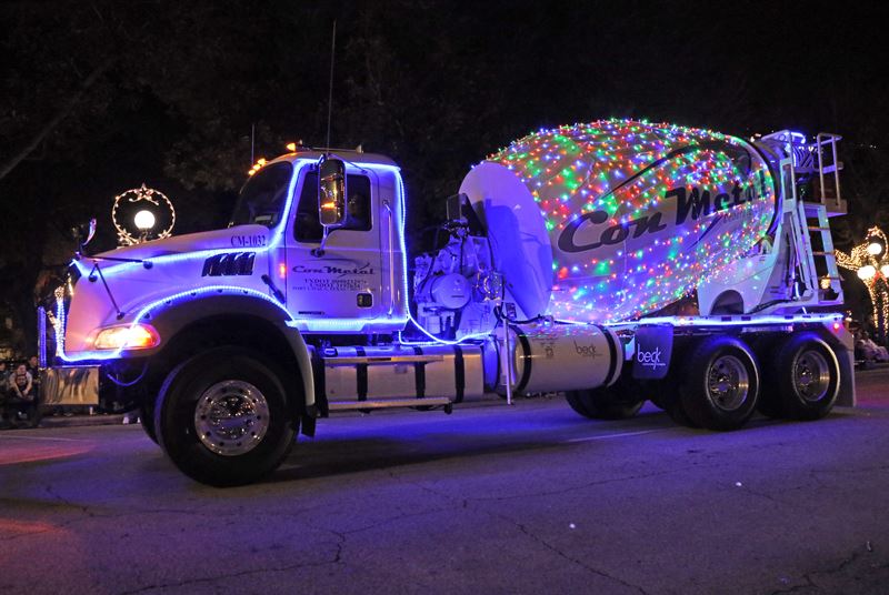 A cement mixer covered in Christmas lights